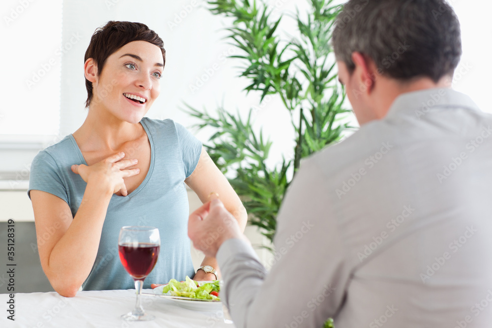 Handsome guy proposing to surprised girlfriend Handsome guy proposing to surprised girlfriend