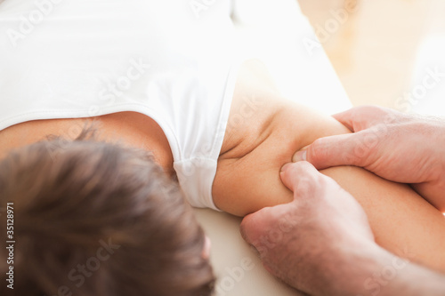 Man massaging a woman's shoulder
