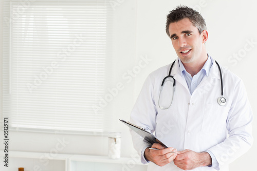 Smiling male Doctor looking into the camera