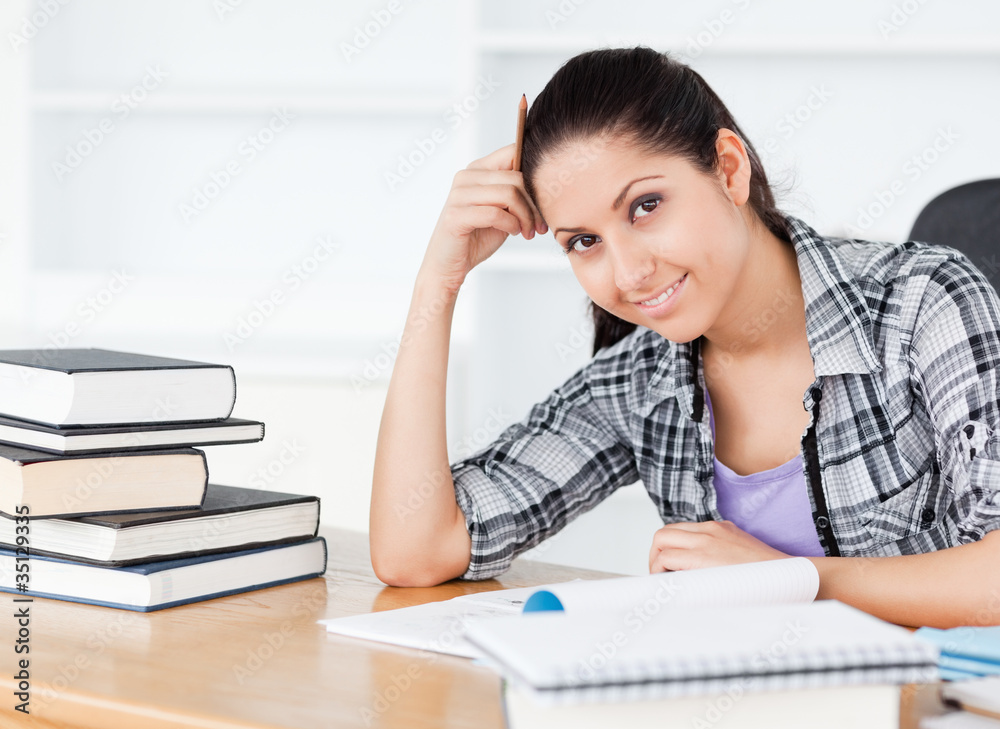 Smiling young student looking to camera Smiling young student looking to camera