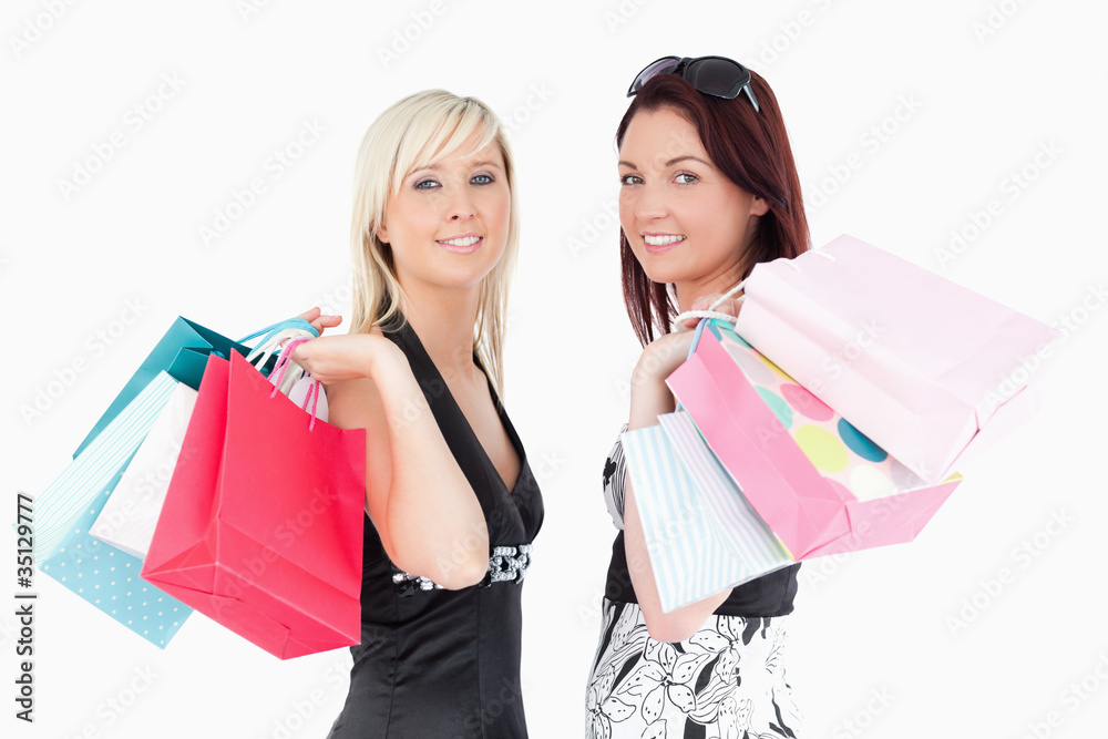Well-dressed women with shopping bags Well-dressed women with shopping bags