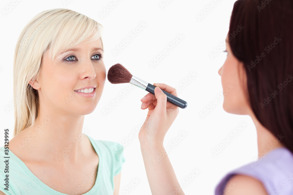 Fototapeta premium Cute Women applying make-up