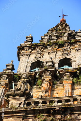 Top of Cathedral of Santiago de Compostela facade with blue sky