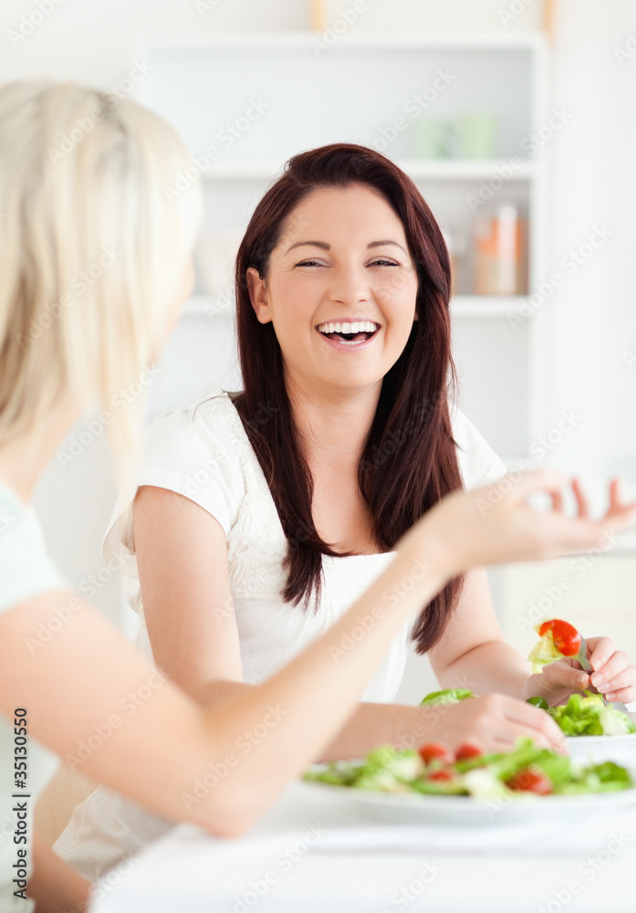 Portrait of cheerful Women eating salad
