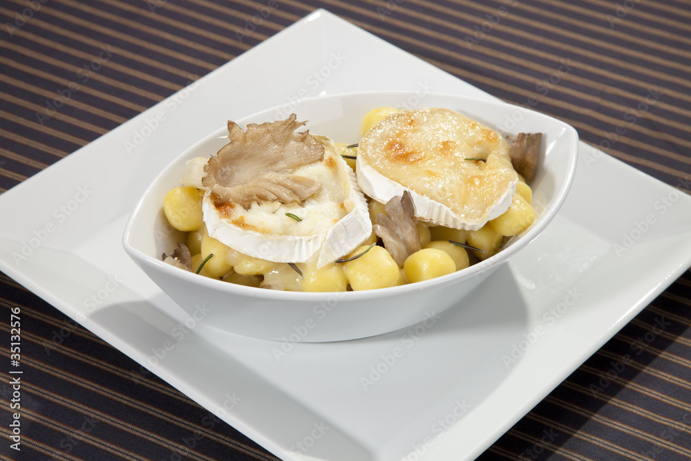 Grilled camembert cheese with the gnochi and mushrooms Grilled camembert cheese with the gnochi and mushrooms