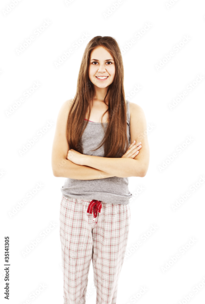 Woman standing in pajamas smiling isolated on white Woman standing in pajamas smiling isolated on white