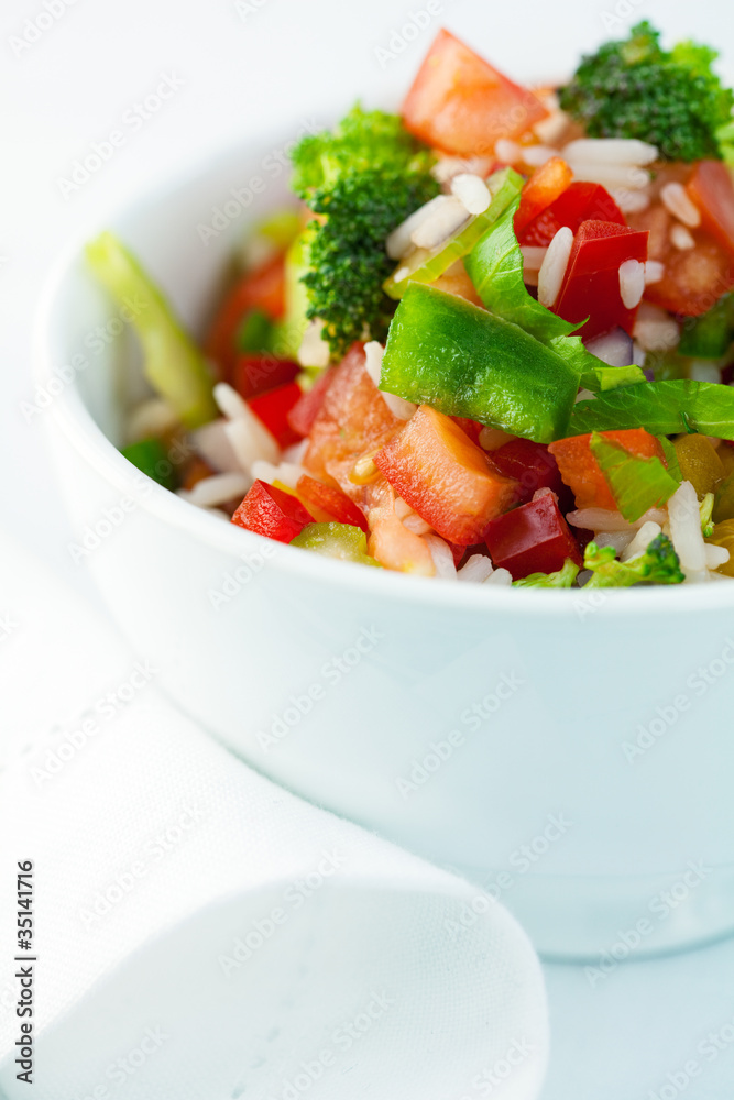 Rice salad with pepper and broccoli flavored with basil