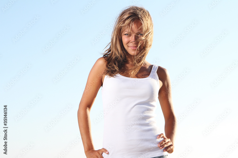 young attractive woman on sky background young attractive woman on sky background