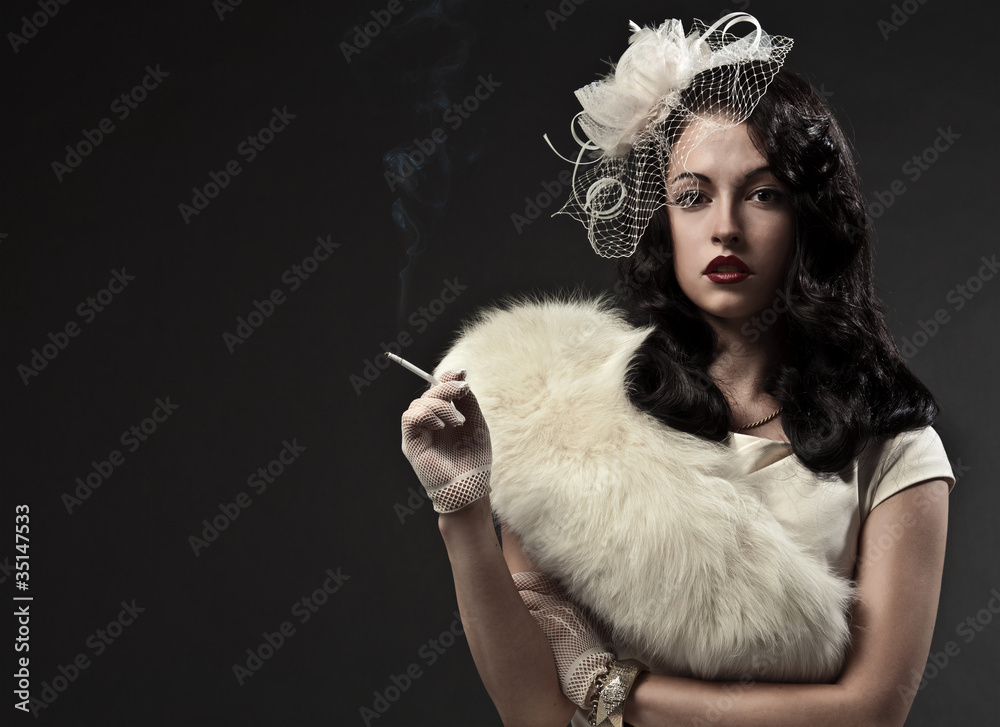 Beautiful smoking woman. Retro portrait Beautiful smoking woman. Retro portrait