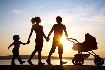 Family walk at sunset