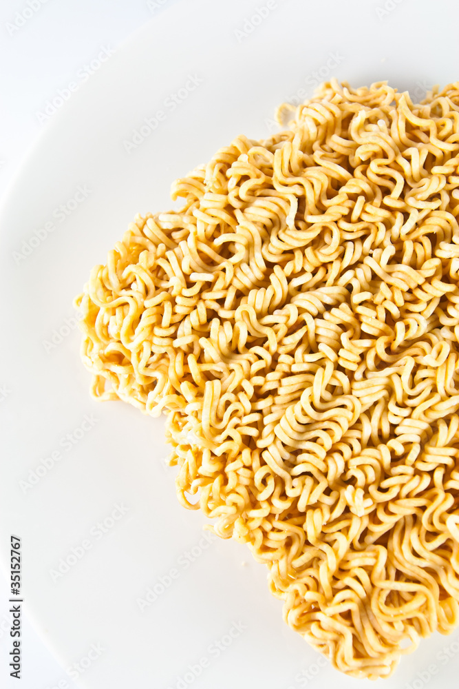 A block of Instant noodles on white background A block of Instant noodles on white background