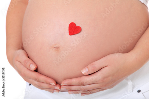Wallpaper Mural Schwangere Frau mit rotem Herz auf Babybauch Torontodigital.ca
