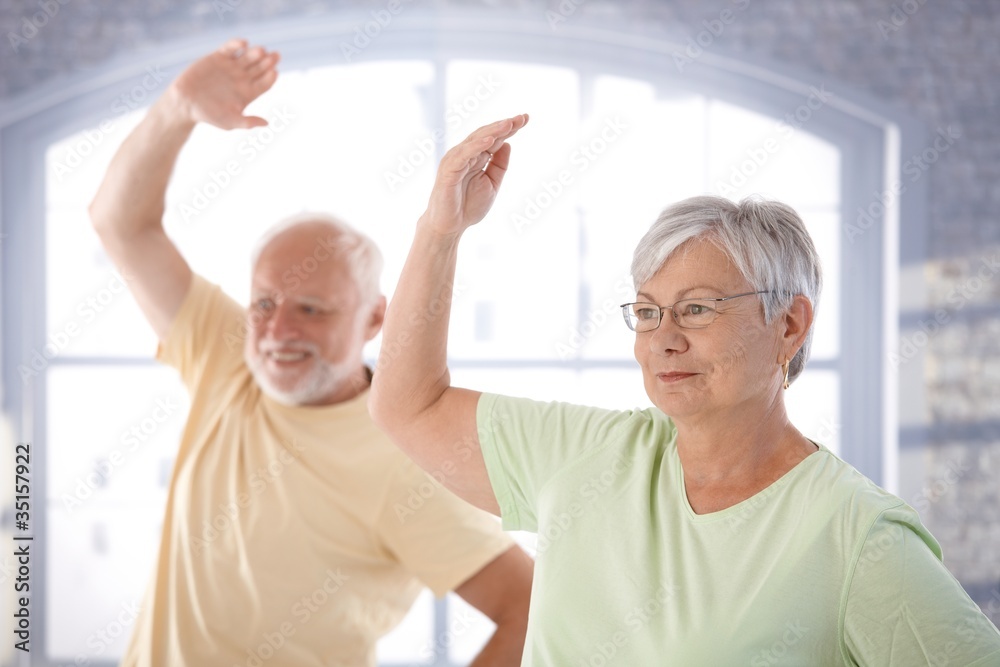 Old couple doing exercises Old couple doing exercises