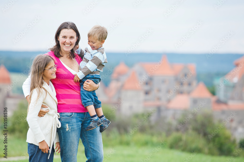 Travelers. Young mother with her two children Travelers. Young mother with her two children