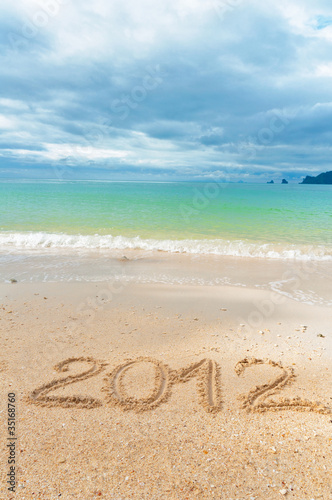 Numbers 2012 on tropical beach sand