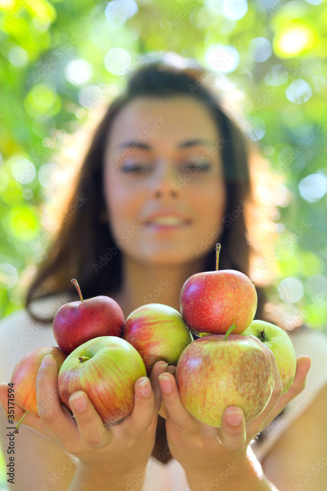 portrait of the gorgeous woman with red apples portrait of the gorgeous woman with red apples