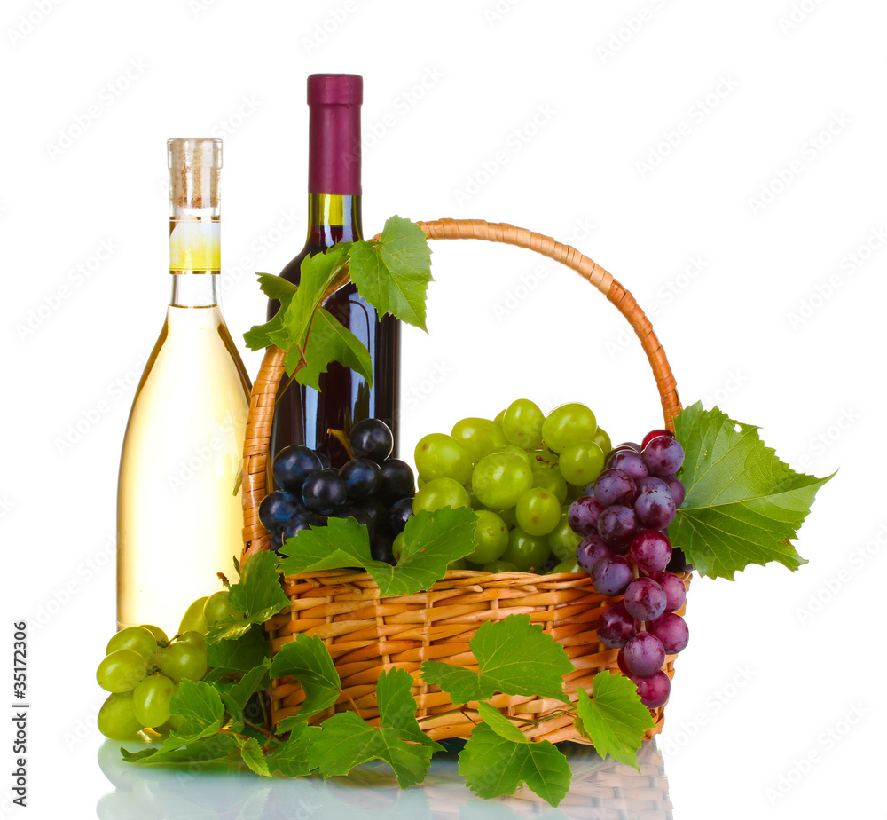 Ripe red grapes and wine in basket isolated on white