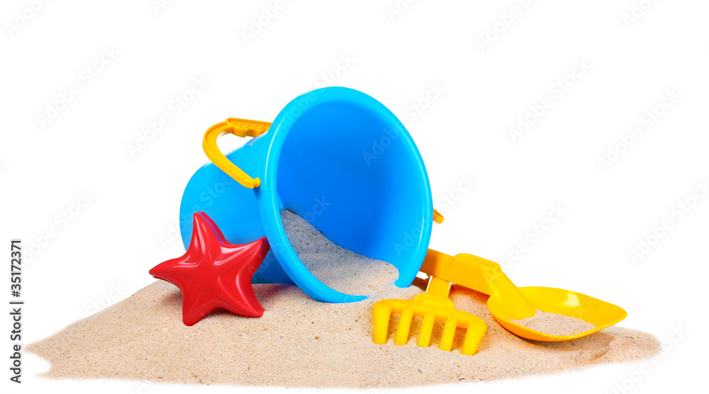 Fototapeta premium children's beach toys and sand isolated on white