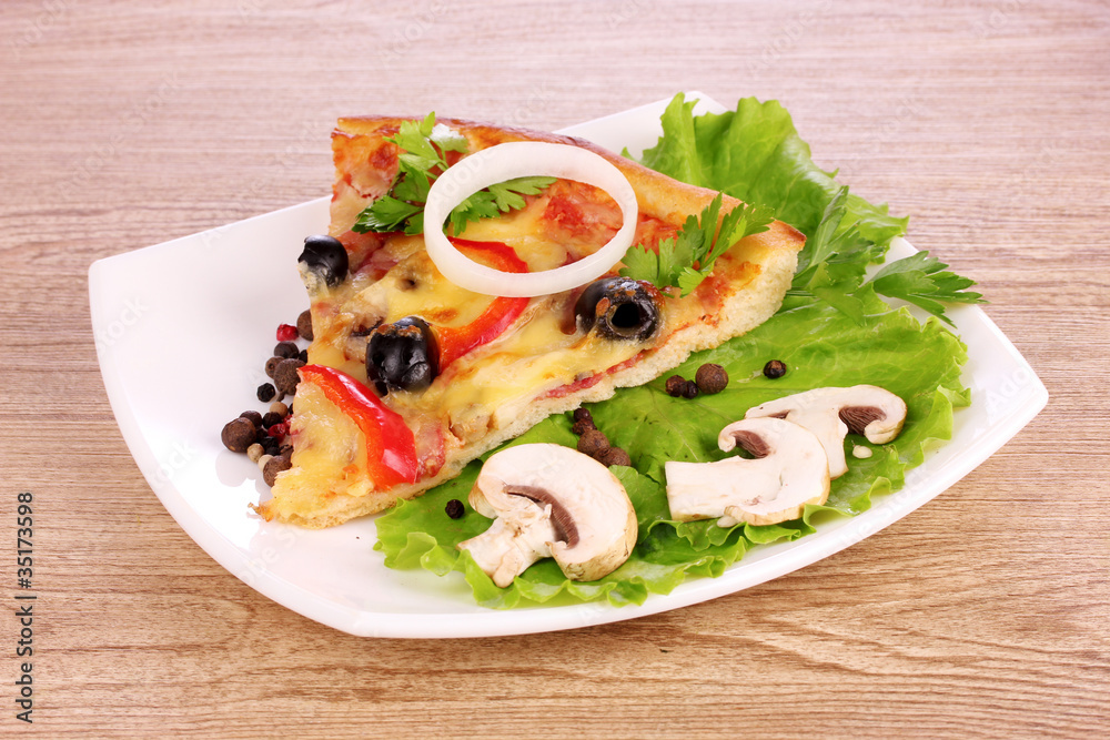 tasty pizza with olives on a wooden background