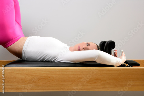 pilates reformer woman gym fitness teacher legs