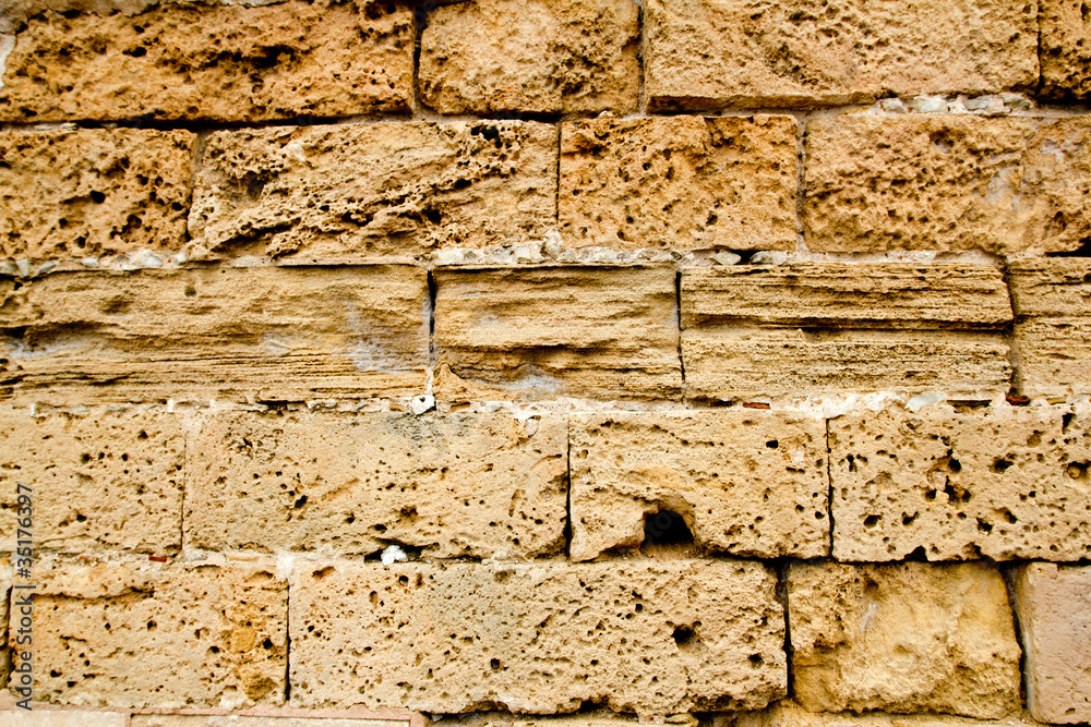 Naklejka premium Mares sandstone stone masonry wall in Majorca