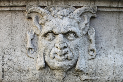 Satyr mask basrelief