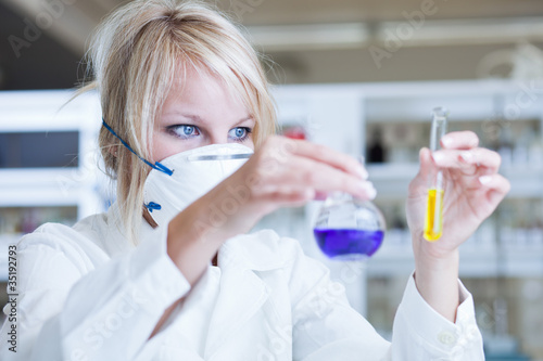 Closeup of a female researcher carrying out experiments in a lab