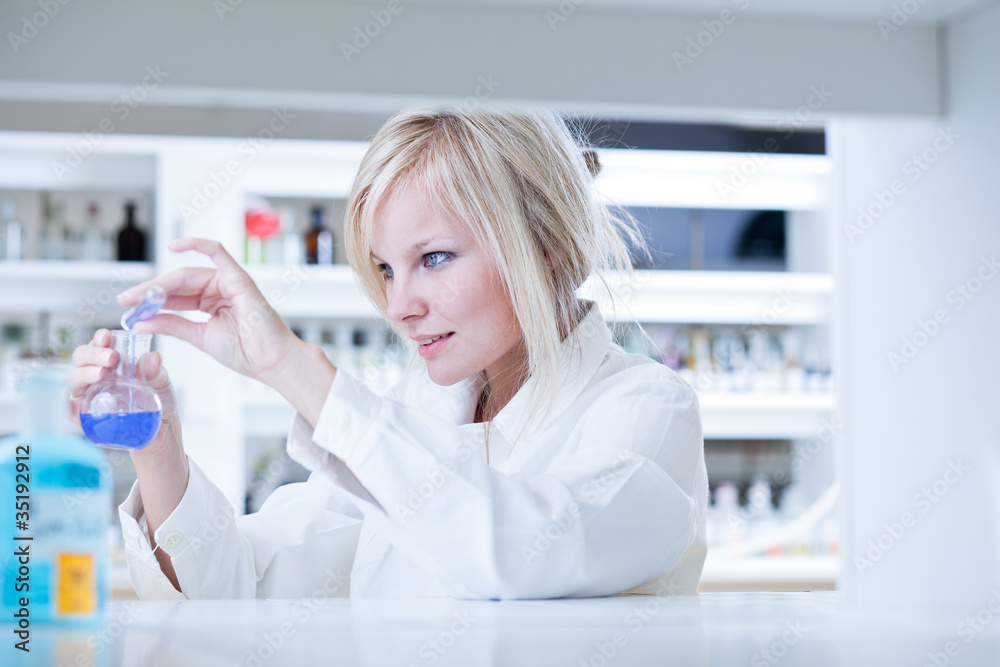 Closeup of a female researcher carrying out experiments in a lab