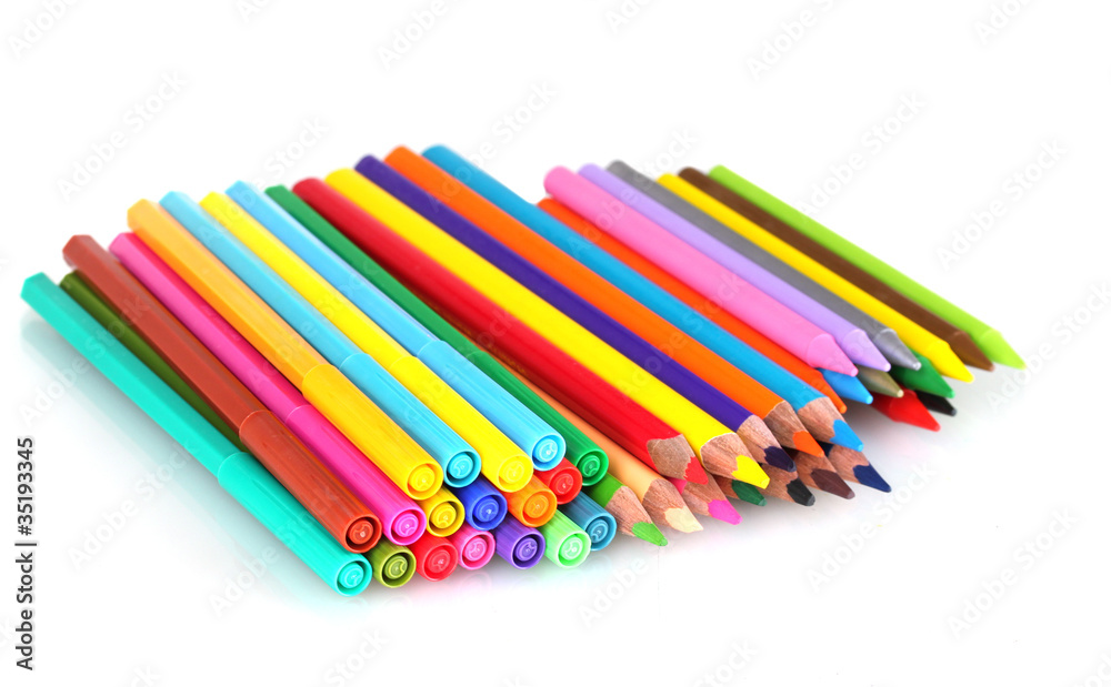 Bright markers and crayons isolated on white