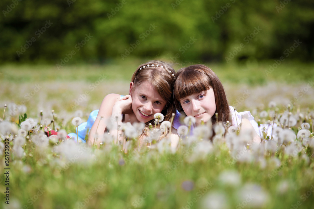 two girls playing in the park two girls playing in the park