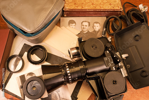 Vintage video camera, accessories and old photo.
