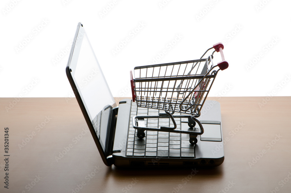 Silhoette of shopping cart and laptop Silhoette of shopping cart and laptop