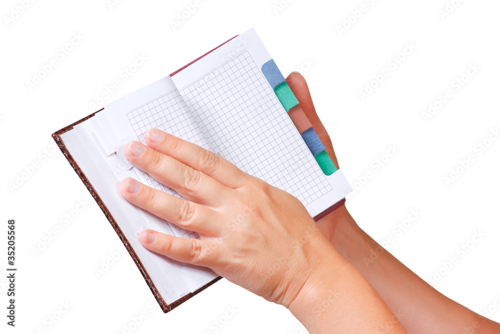Open notebook for notes in the hands Open notebook for notes in the hands