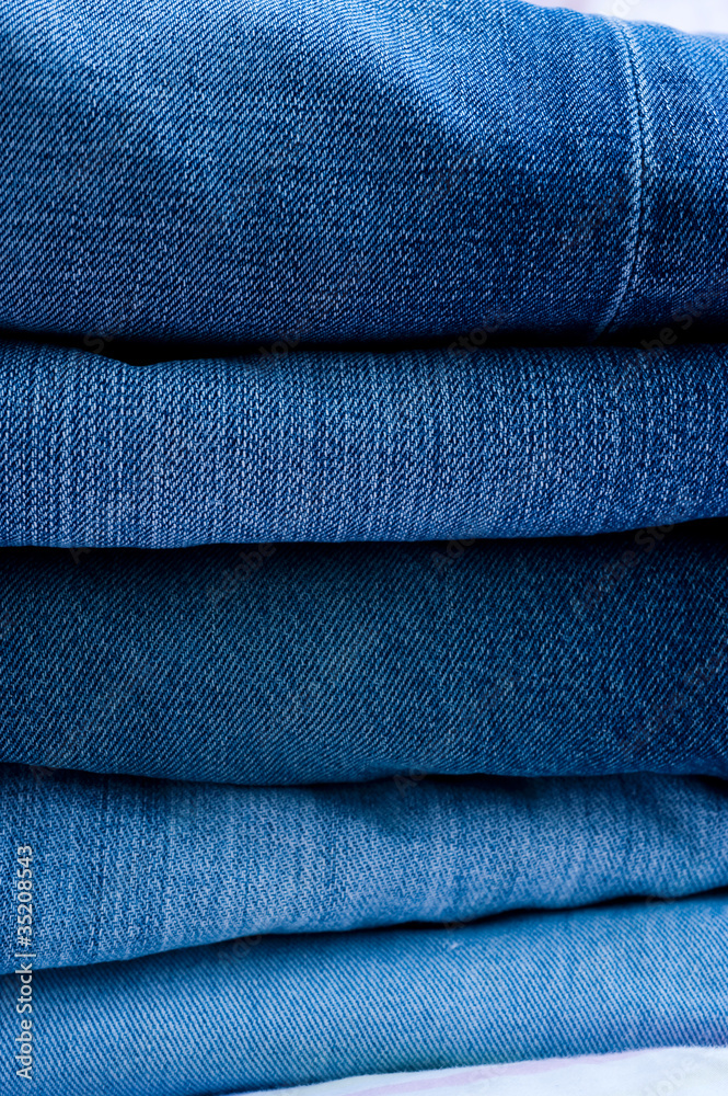 stack of blue jeans