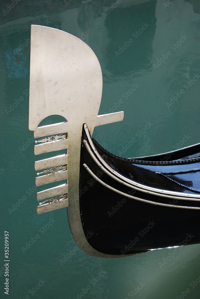 Detail of the iron bow of a venetian gondola boat, Venice, Italy