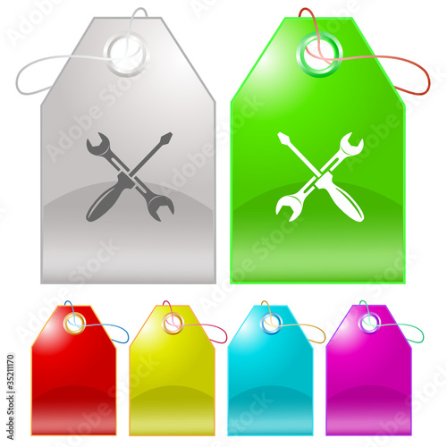 Screwdriver and spanner. Vector tags.