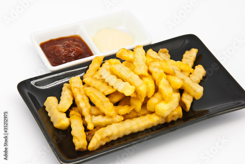French fries in black plate