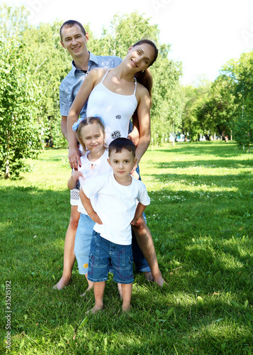Family with two children in the summer park © Sergey Nivens