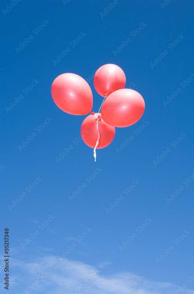 Flying balloons on blue backround