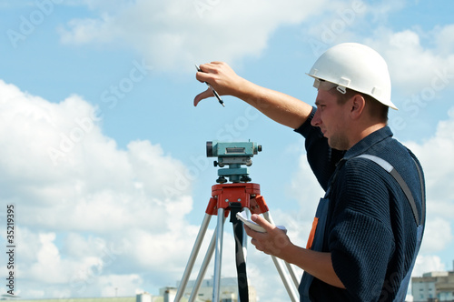 surveyor works with theodolite