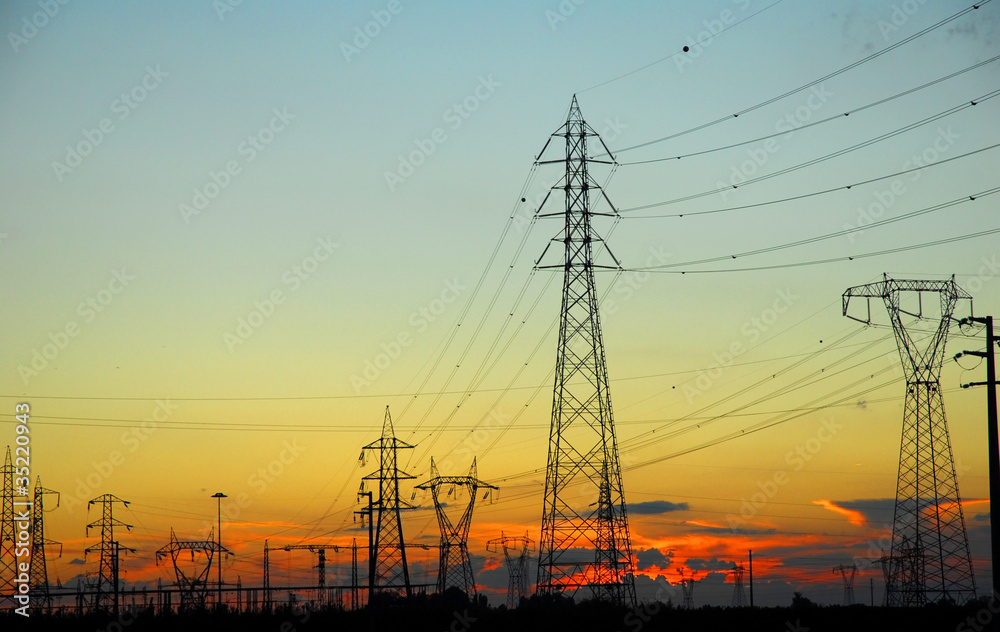 Fototapeta premium Ravenna, transmission lines at sunset.