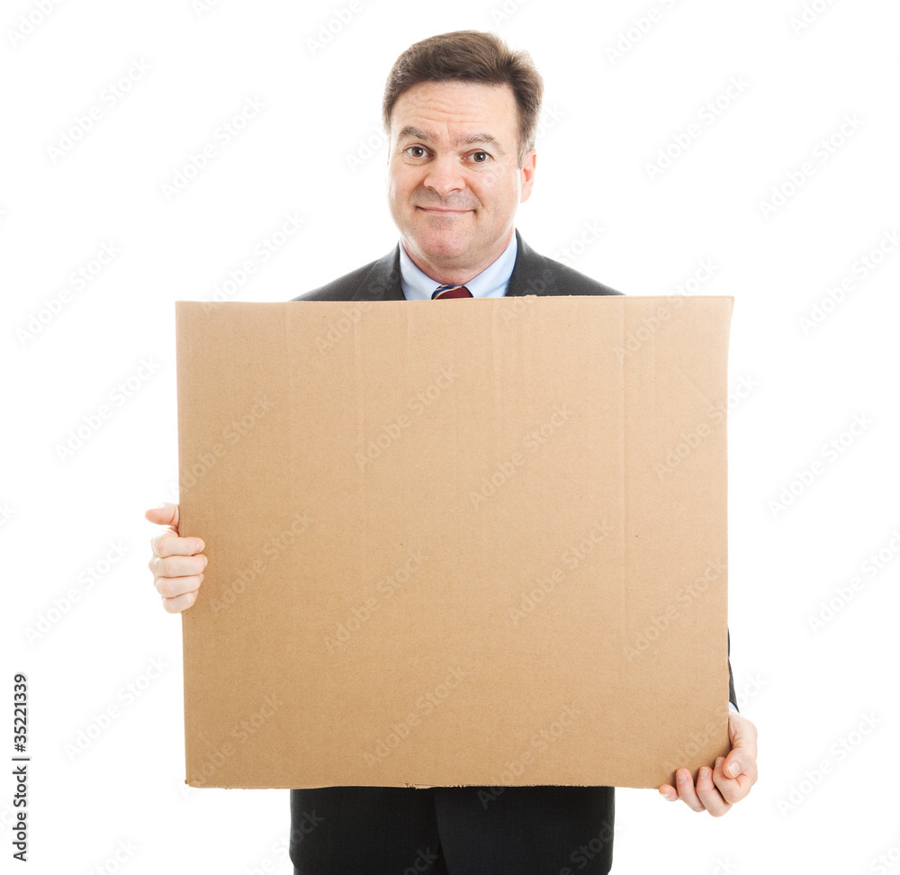 Embarrassed Businessman with Cardboard Sign Embarrassed Businessman with Cardboard Sign