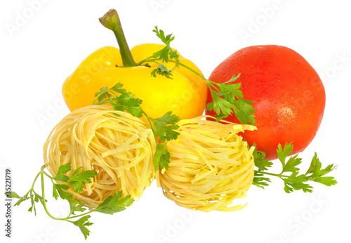 Raw pasta with tomato, pepper and greens isolated