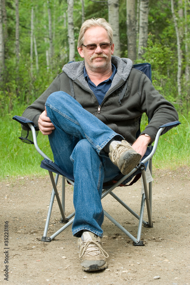 Man in Camping Chair Outside