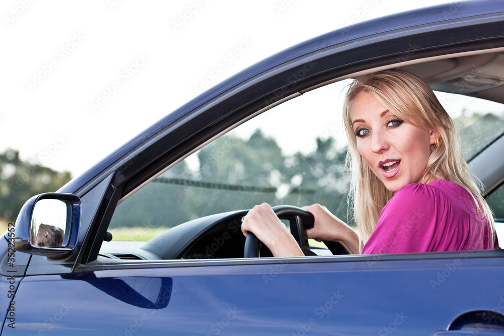 Beautiful blonde girl driver