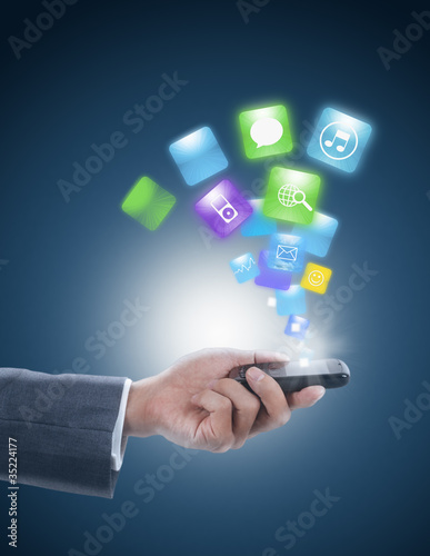 businessman holding mobile phone with graphic icon
