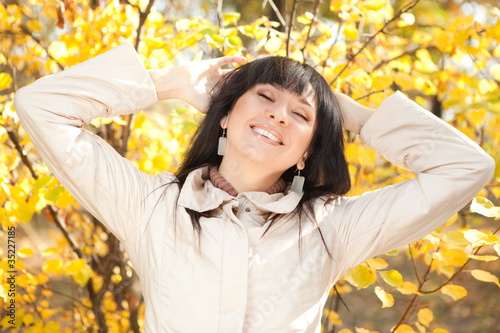 Young pretty woman in the autumn park