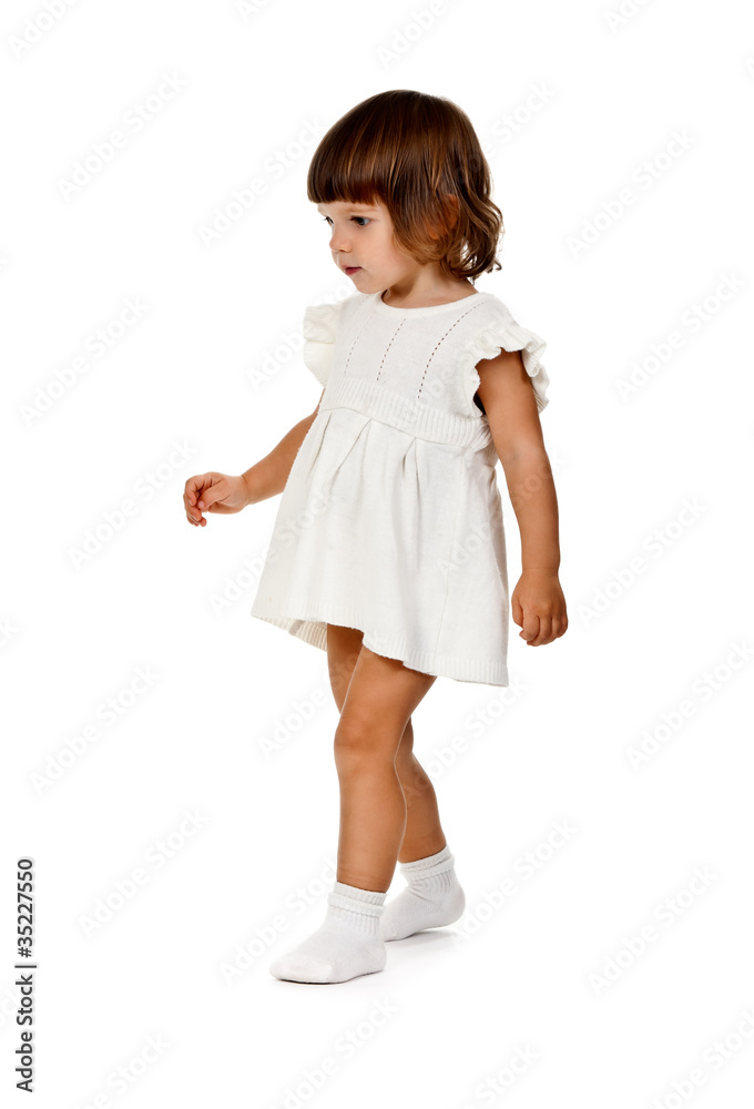 little girl in a knitted dress in the studio little girl in a knitted dress in the studio