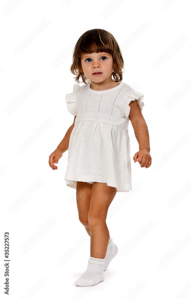 little girl in a knitted dress in the studio little girl in a knitted dress in the studio