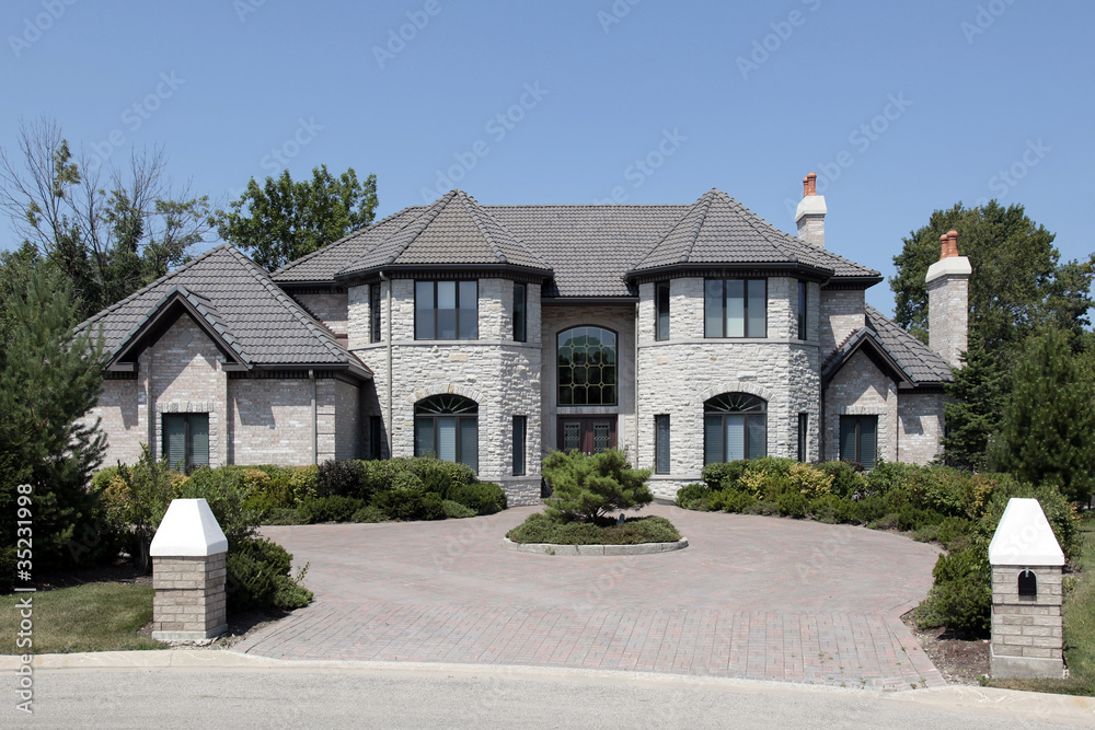 Large stone home with pillars
